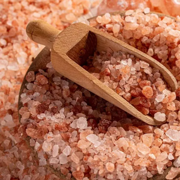 A pile of Pink Himalayan Salt with a scoop.