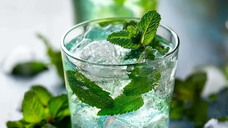 Glass of water with peppermint.