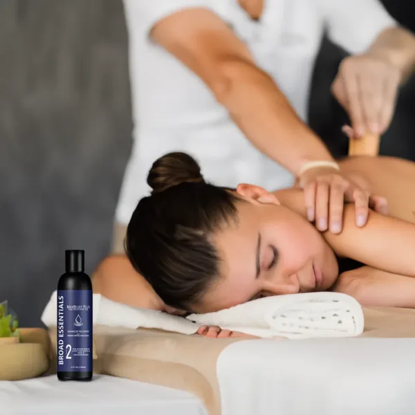 A woman being massaged with a CBD Massage Oil.