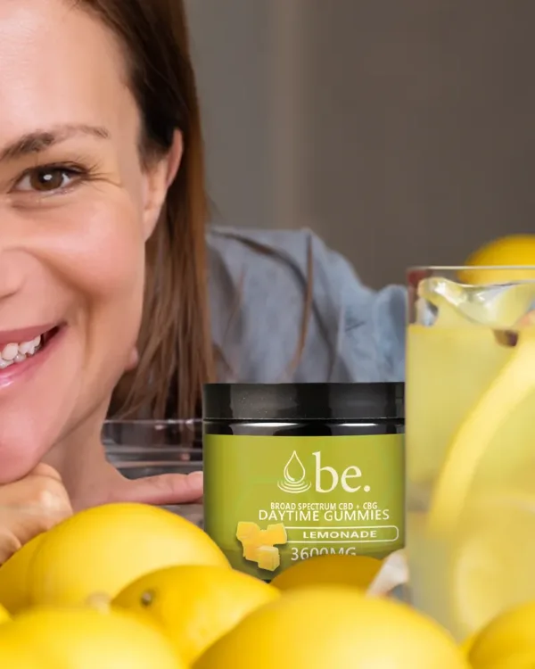 A table full of lemons with a jar of CBG Daytime Gummies