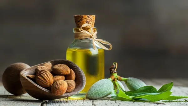 Sweet Almond seeds and a bottle of oil.