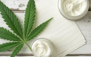 CBD cream and some cannabis leaves.